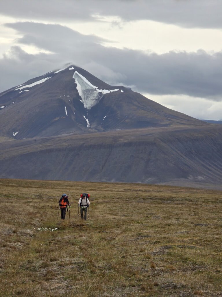 Camp with mountain peak in background